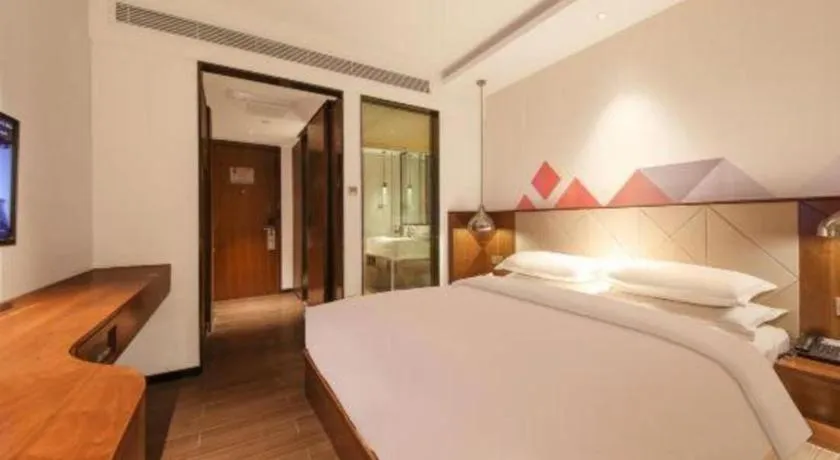 Bed in Borrman Hotel Zhongxiang Railway Station Mochou Village