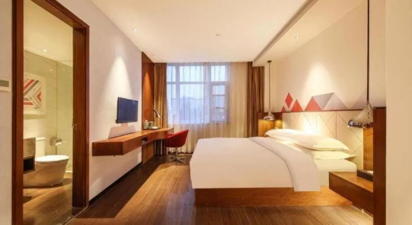 Bed in Borrman Hotel Zhongxiang Railway Station Mochou Village