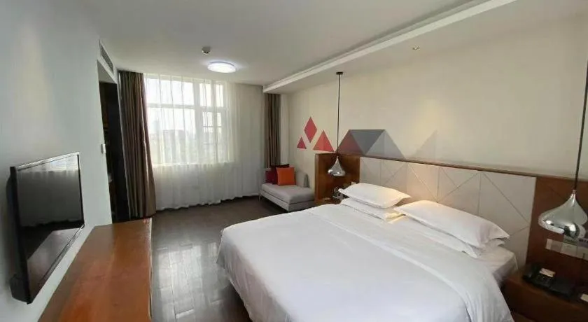 Bed in Borrman Hotel Zhongxiang Railway Station Mochou Village