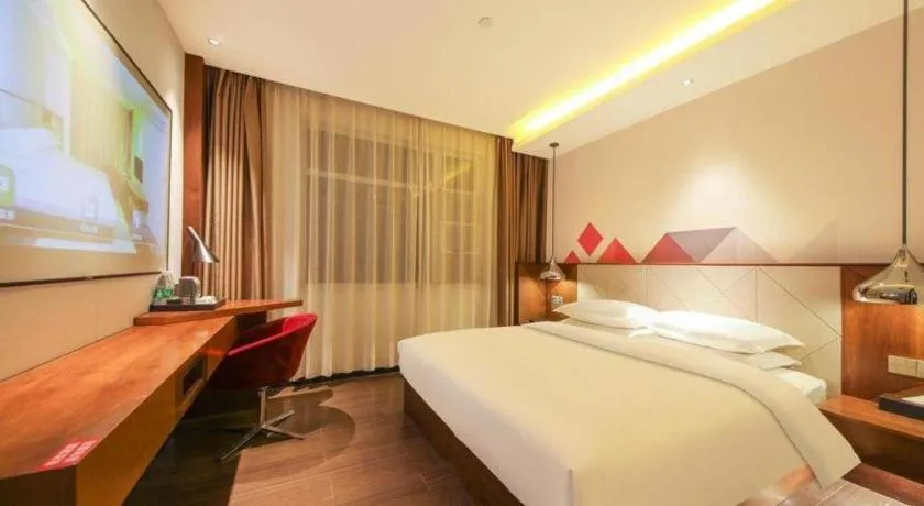 Bed in Borrman Hotel Zhongxiang Railway Station Mochou Village