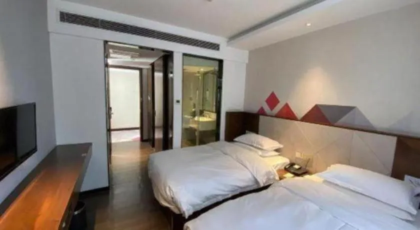 Bed in Borrman Hotel Zhongxiang Railway Station Mochou Village