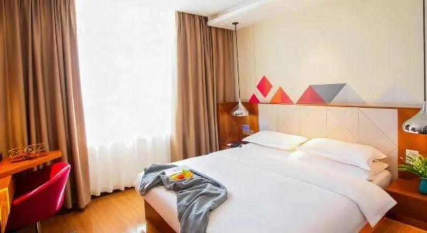 Bed in Borrman Hotel Zhongxiang Railway Station Mochou Village