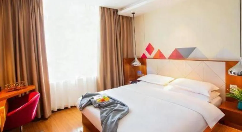 Bed in Borrman Hotel Zhongxiang Railway Station Mochou Village