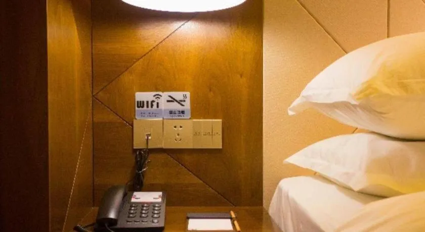 Bed in Borrman Hotel Zhongxiang Railway Station Mochou Village