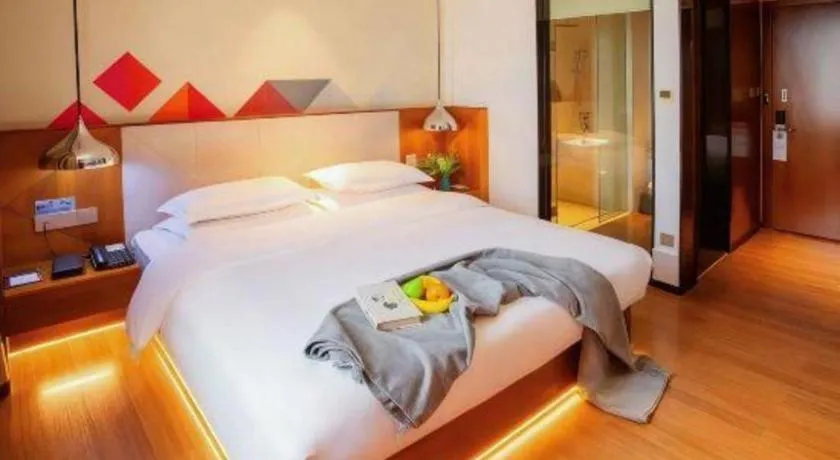 Bed in Borrman Hotel Zhongxiang Railway Station Mochou Village