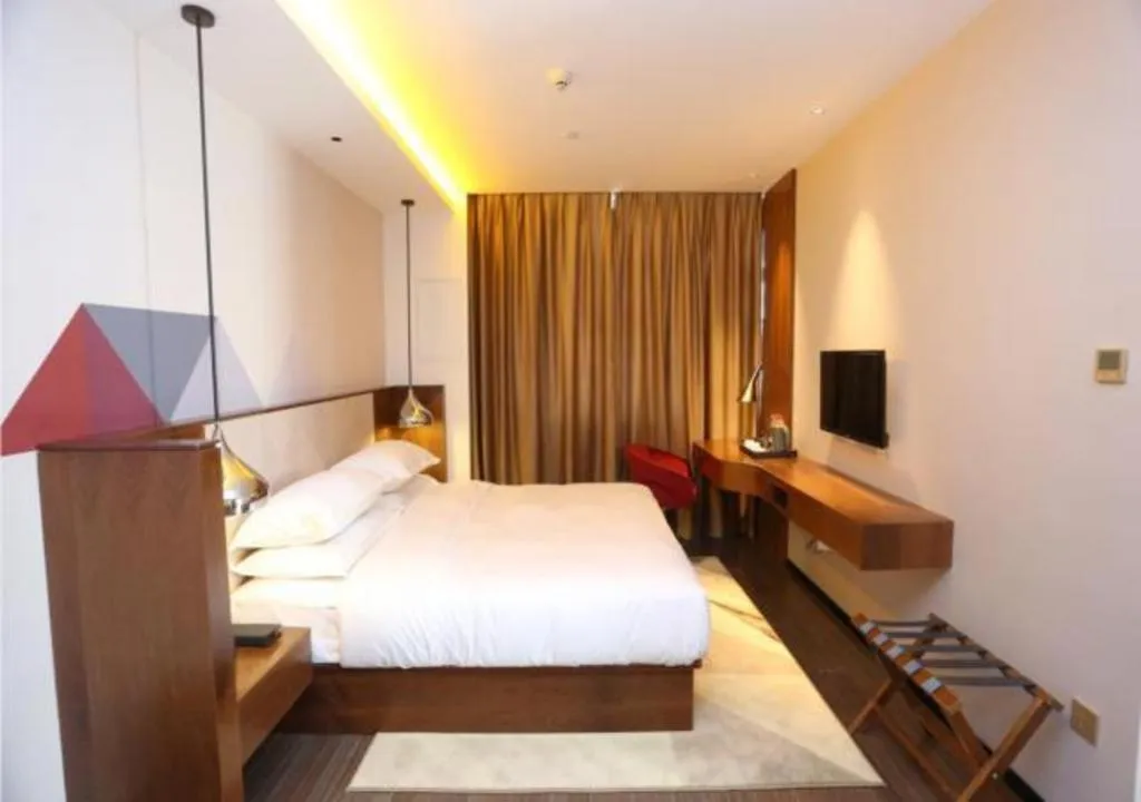 Bed in Borrman Hotel Zhongxiang Railway Station Mochou Village