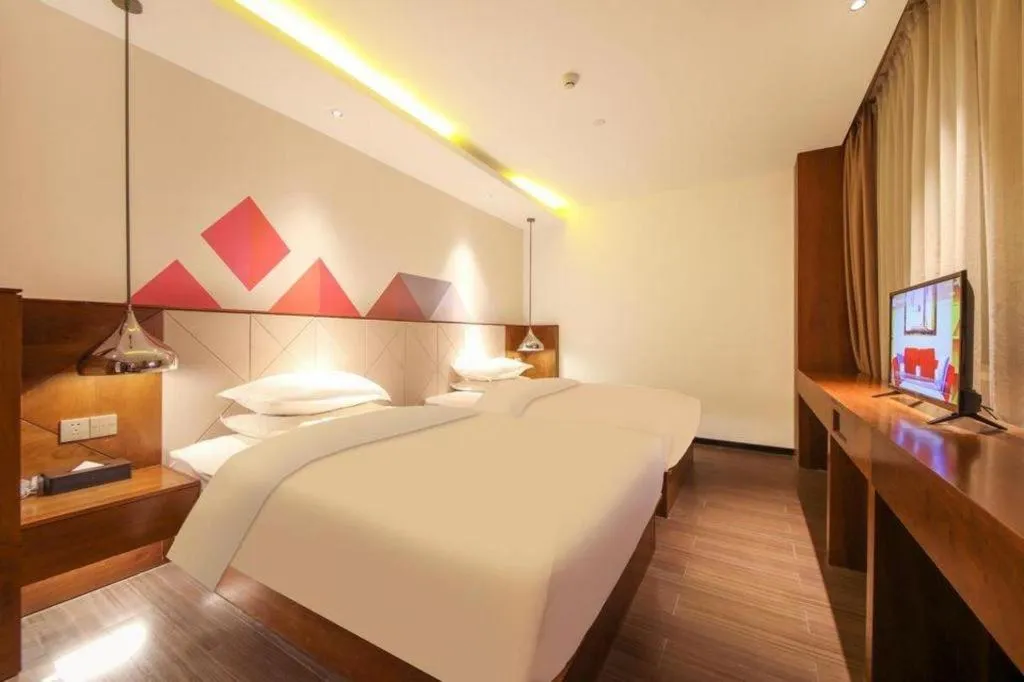 Bed in Borrman Hotel Zhongxiang Railway Station Mochou Village