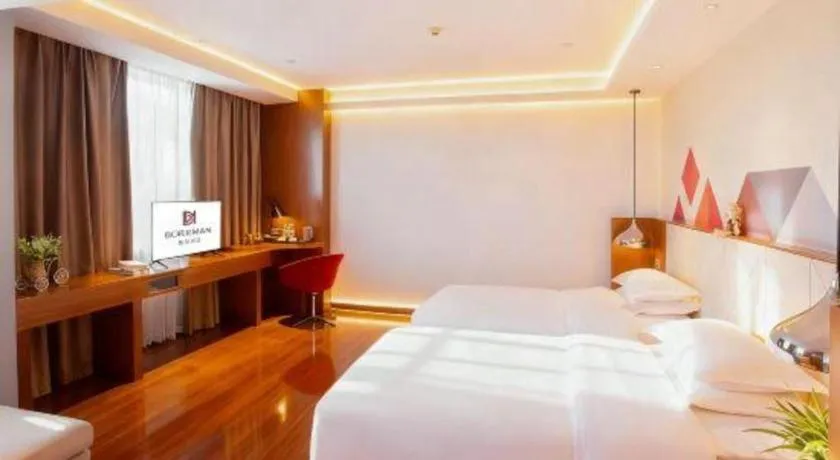 Bed in Borrman Hotel Zhongxiang Railway Station Mochou Village