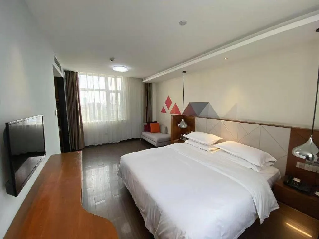 Bed in Borrman Hotel Zhongxiang Railway Station Mochou Village