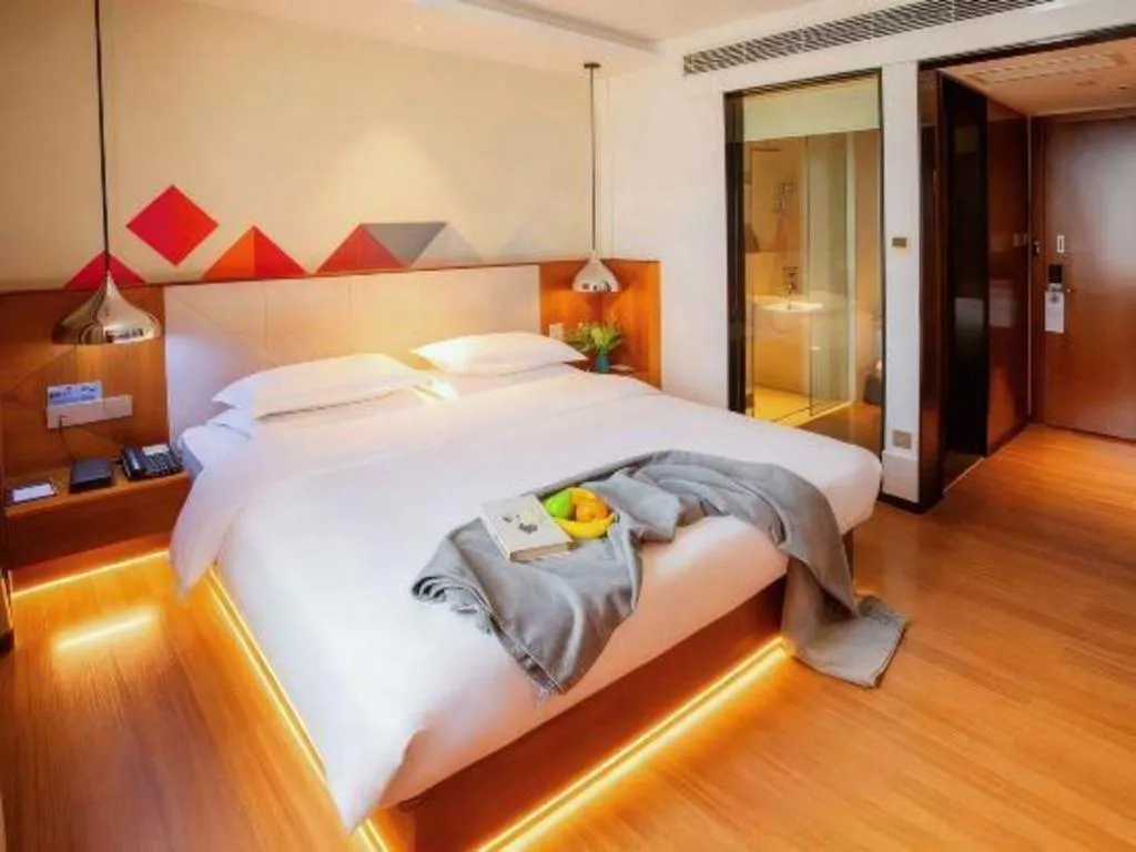 Bed in Borrman Hotel Zhongxiang Railway Station Mochou Village