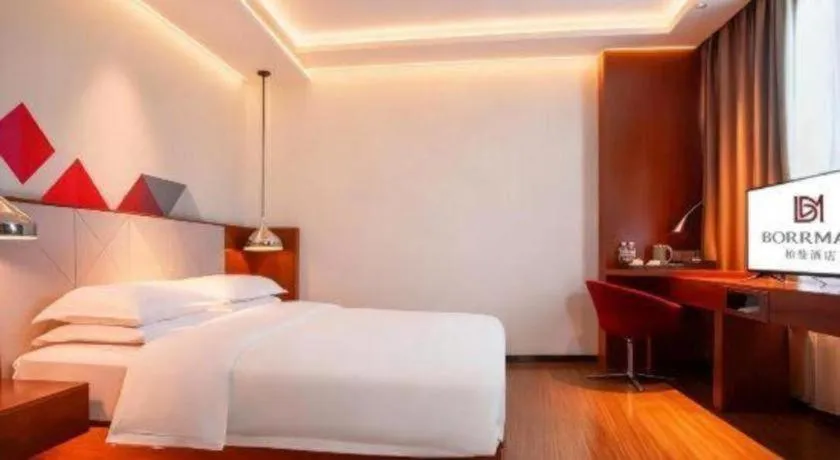 Bed in Borrman Hotel Zhongxiang Railway Station Mochou Village