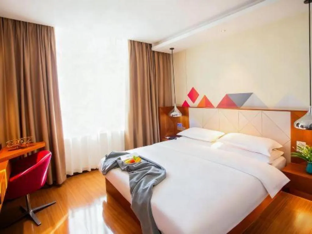 Bed in Borrman Hotel Zhongxiang Railway Station Mochou Village