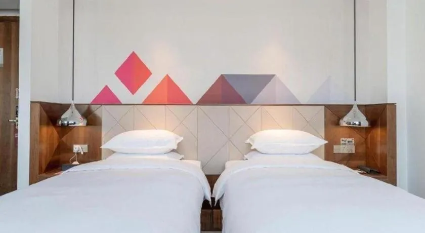 Bed in Borrman Hotel Zhongxiang Railway Station Mochou Village