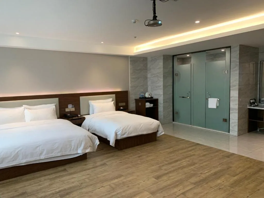 Bed in Borrman Hotel East Huai'an Railway Station Zhou 'Enlai Memorial