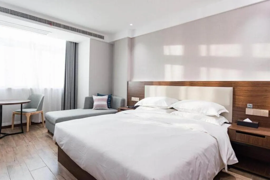 Bed in Borrman Hotel East Huai'an Railway Station Zhou 'Enlai Memorial