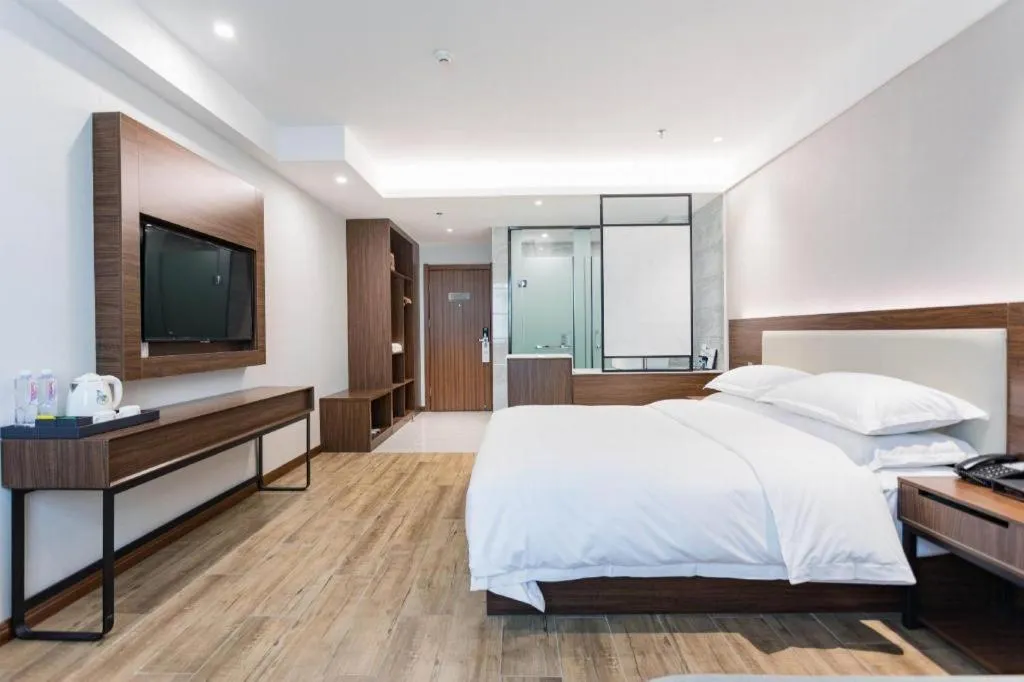 Bed in Borrman Hotel East Huai'an Railway Station Zhou 'Enlai Memorial