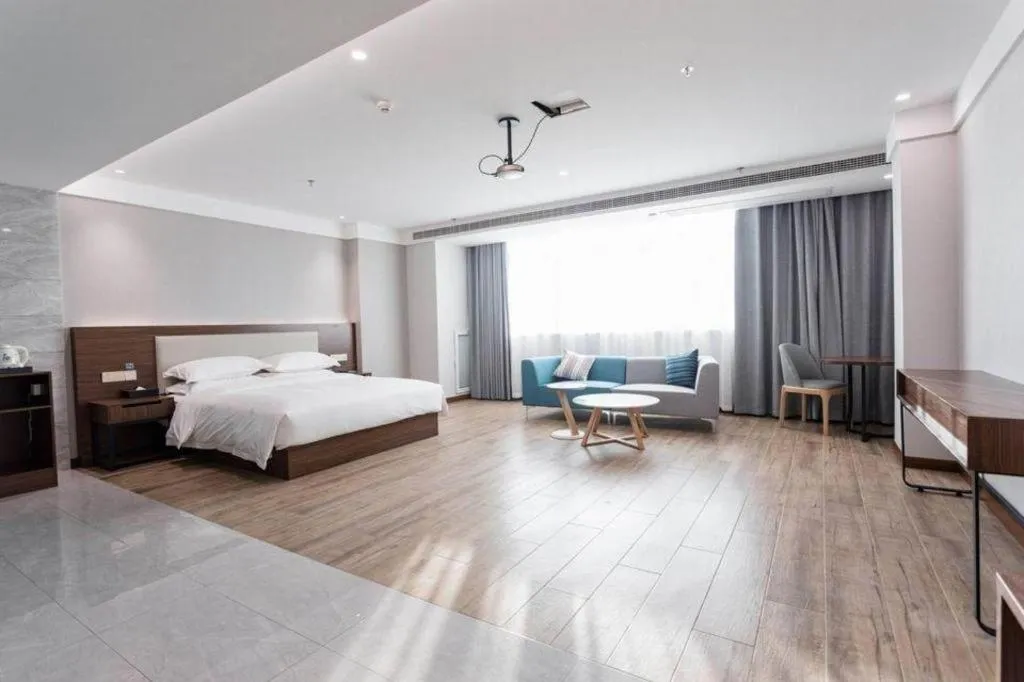 Bed in Borrman Hotel East Huai'an Railway Station Zhou 'Enlai Memorial