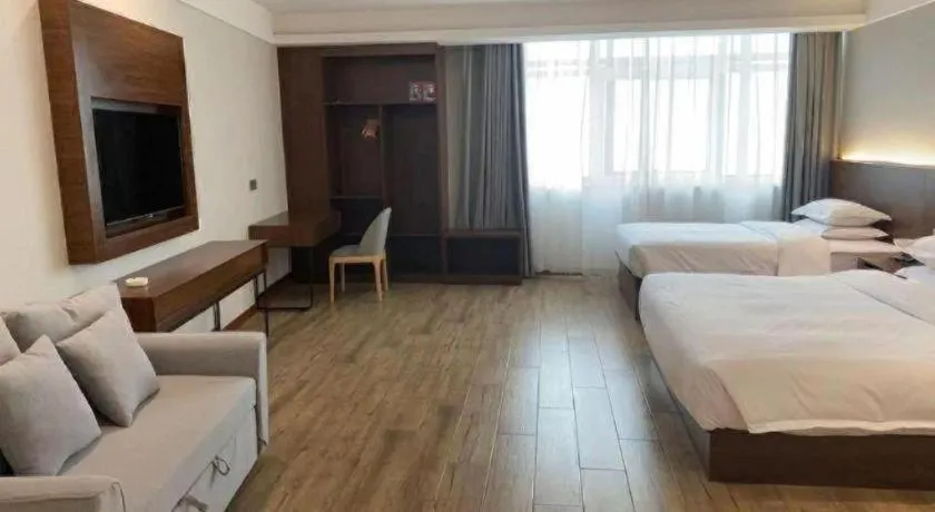 Bed in Borrman Hotel East Huai'an Railway Station Zhou 'Enlai Memorial