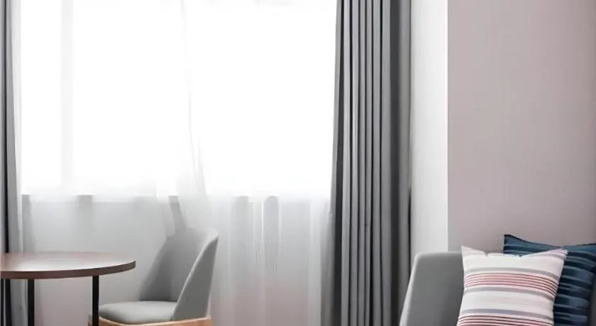 Bed in Borrman Hotel East Huai'an Railway Station Zhou 'Enlai Memorial