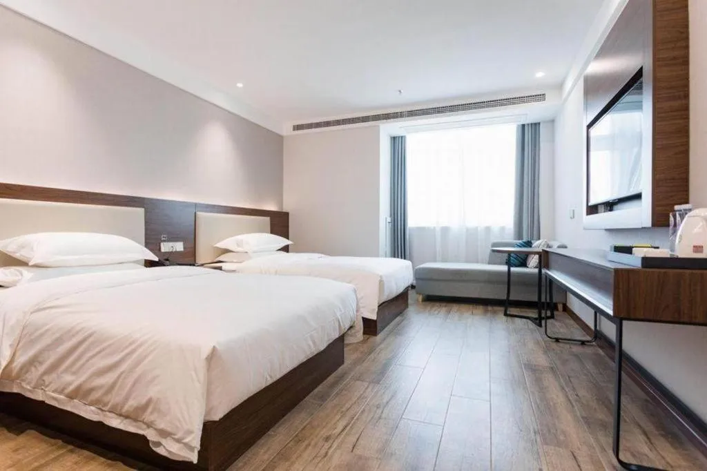 Bed in Borrman Hotel East Huai'an Railway Station Zhou 'Enlai Memorial