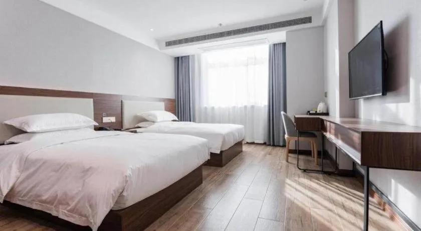 Bed in Borrman Hotel East Huai'an Railway Station Zhou 'Enlai Memorial