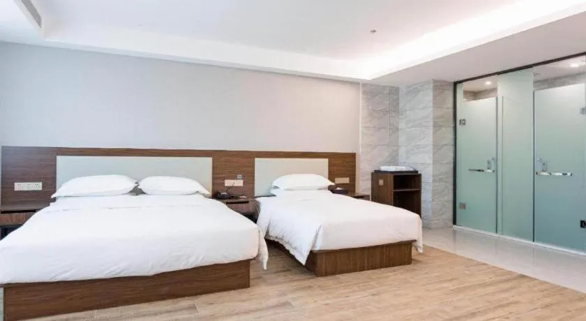 Bed in Borrman Hotel East Huai'an Railway Station Zhou 'Enlai Memorial