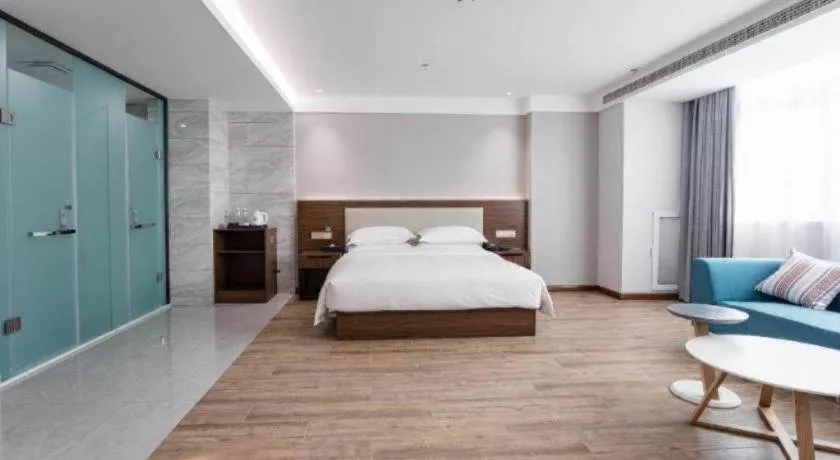 Bed in Borrman Hotel East Huai'an Railway Station Zhou 'Enlai Memorial