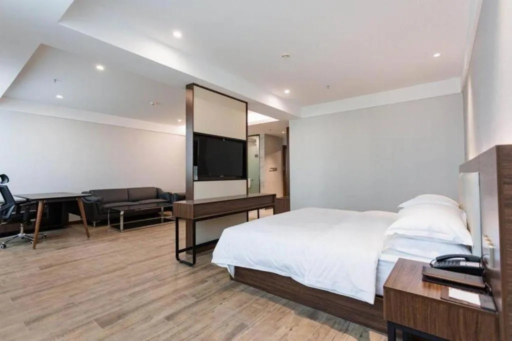 Bed in Borrman Hotel East Huai'an Railway Station Zhou 'Enlai Memorial