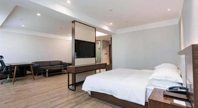 Bed in Borrman Hotel East Huai'an Railway Station Zhou 'Enlai Memorial