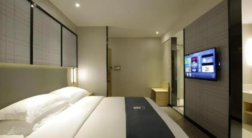 Bed in JTOUR Inn Wuzhou Arcade City Sanzongfu