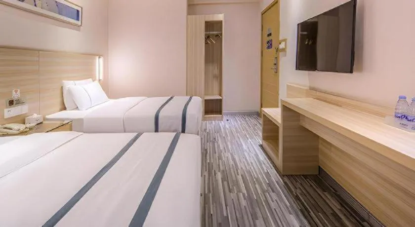 Bed in JTOUR Inn Wuzhou Arcade City Sanzongfu