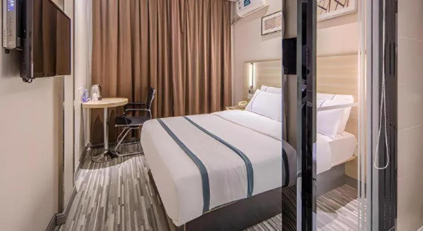 Bed in JTOUR Inn Wuzhou Arcade City Sanzongfu