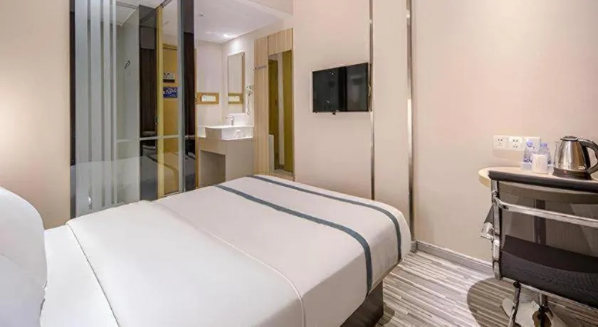 Bed in JTOUR Inn Wuzhou Arcade City Sanzongfu