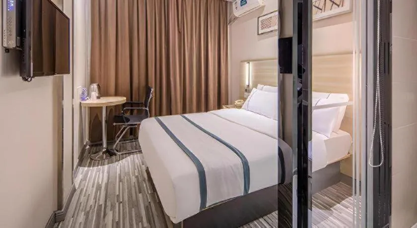 Bed in JTOUR Inn Wuzhou Arcade City Sanzongfu