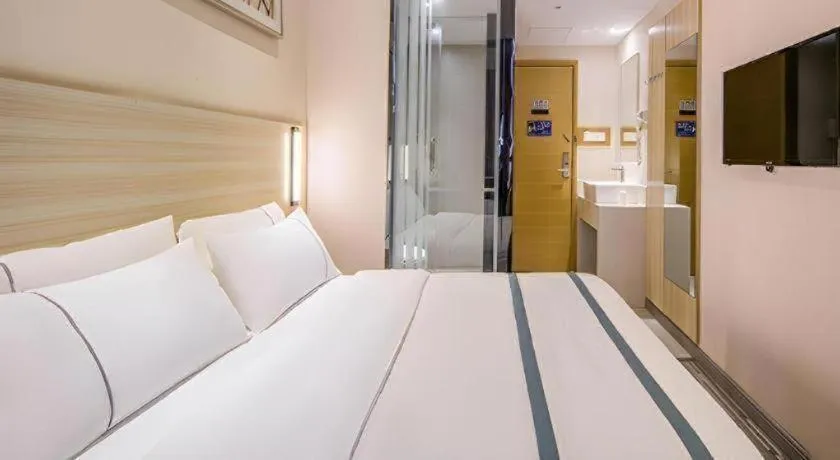 Bed in JTOUR Inn Wuzhou Arcade City Sanzongfu