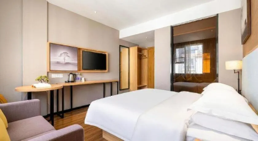 Bed in JTOUR Inn Guigang Life Port High-speed Railway Station