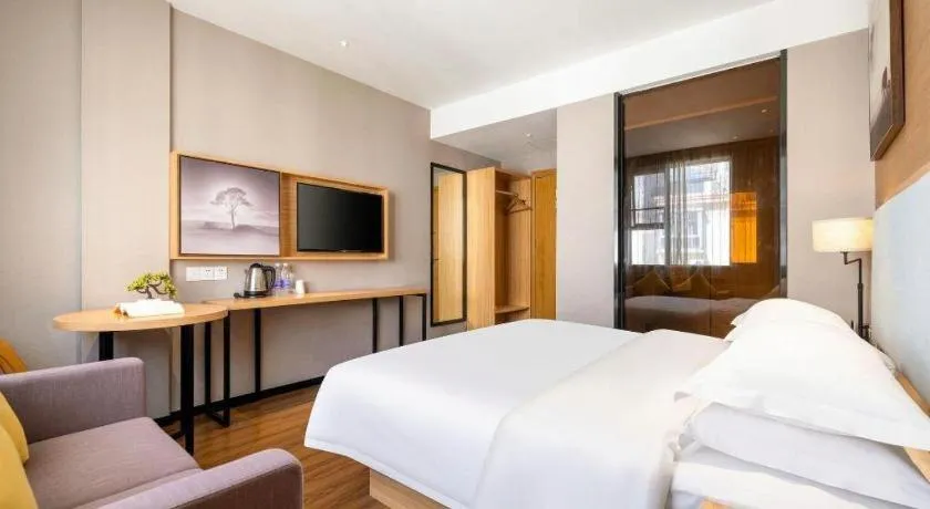 Bed in JTOUR Inn Guigang Life Port High-speed Railway Station