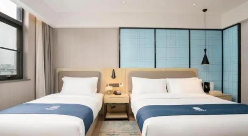 Bed in Echarm Hotel Jianshui Gucheng