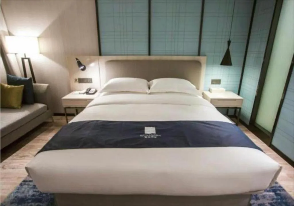Bed in Echarm Hotel Jianshui Gucheng