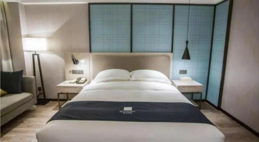 Bed in Echarm Hotel Jianshui Gucheng