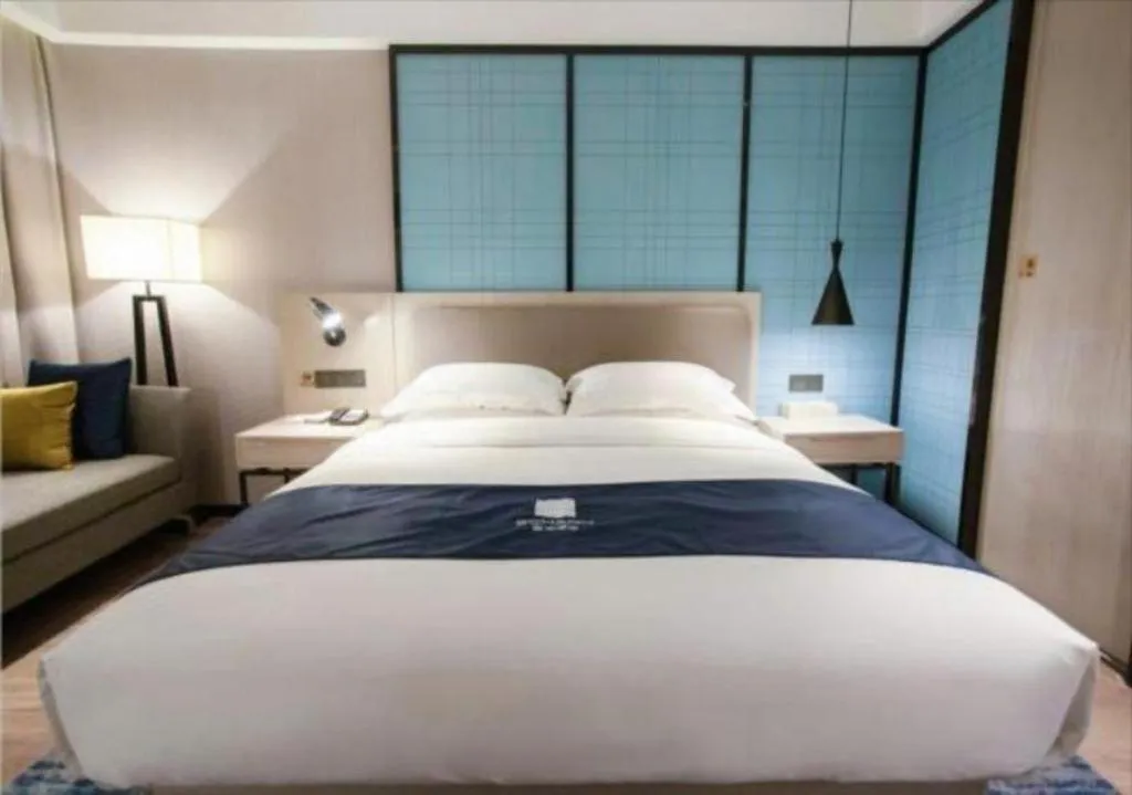 Bed in Echarm Hotel Jianshui Gucheng