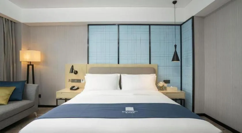 Bed in Echarm Hotel Jianshui Gucheng