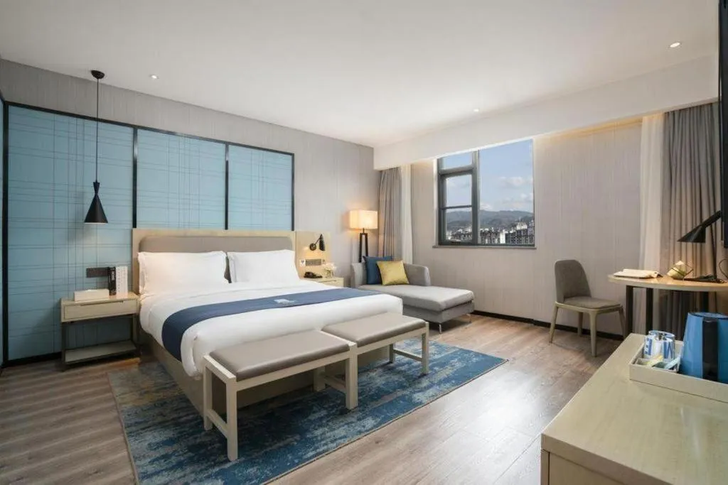 Bed in Echarm Hotel Jianshui Gucheng