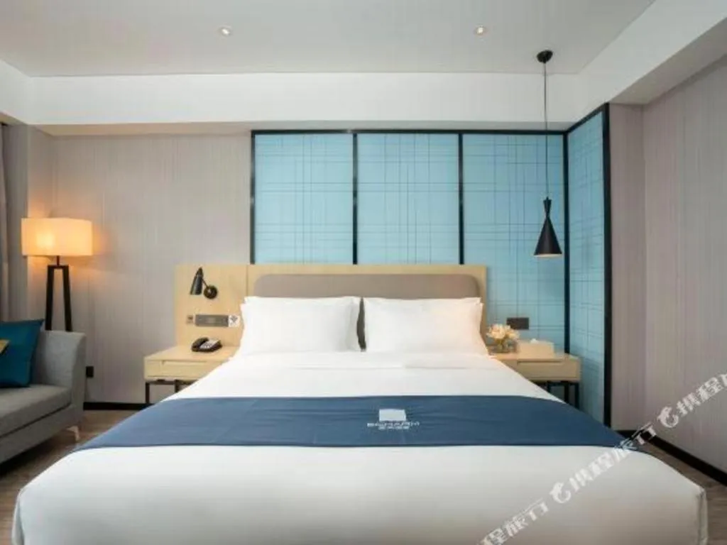 Bed in Echarm Hotel Jianshui Gucheng