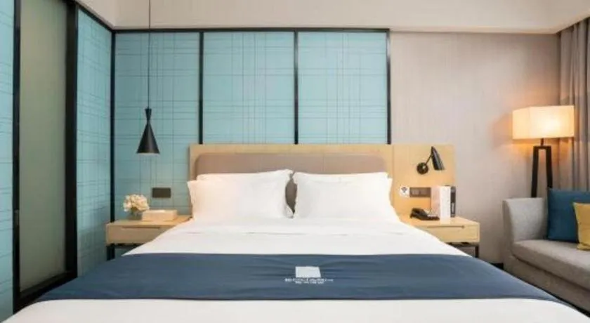 Bed in Echarm Hotel Jianshui Gucheng