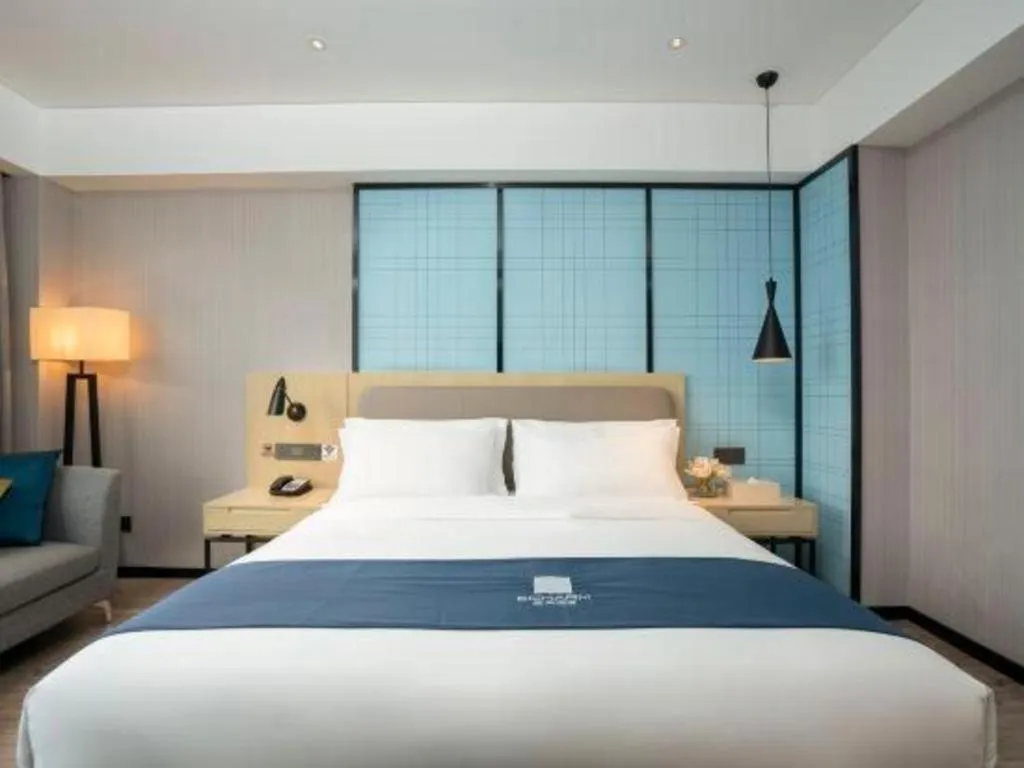 Bed in Echarm Hotel Jianshui Gucheng