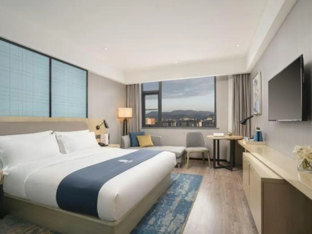 Bed in Echarm Hotel Jianshui Gucheng