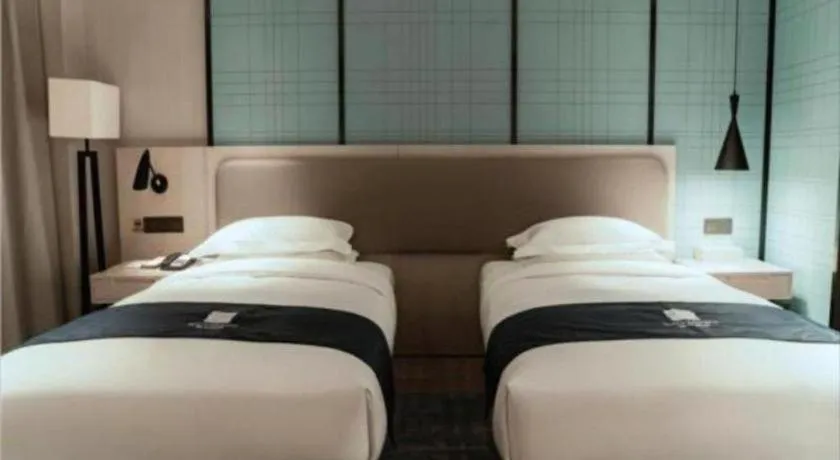 Bed in Echarm Hotel Jianshui Gucheng