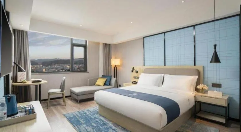 Bed in Echarm Hotel Jianshui Gucheng