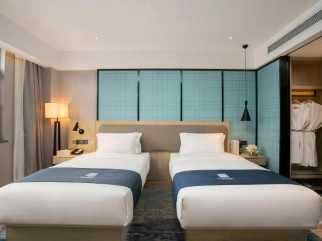 Bed in Echarm Hotel Jianshui Gucheng
